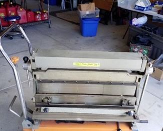 Sheet metal press with stand