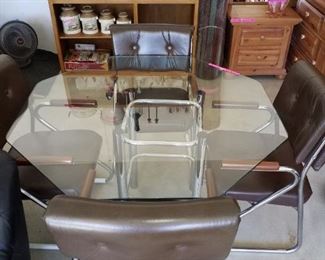 Glass top table with 4 chairs