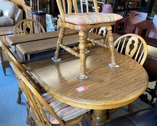 Oak table and six chairs by Cochrane