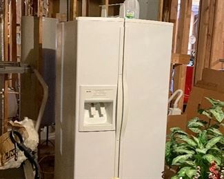 Refrigerator/freezer with ice and water dispenser on door