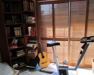 Books, guitar, exercise bike