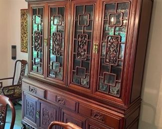 SPECTACULAR CHINESE HIGHLY CARVED DINING SET . WONDERFUL GLASS FRONT BREAKFRONT, TABLE WITH LEAF AND SIX SIDE CHAIRS AND TWO ARM CHAIRS. EXCELLENT CONDITION
