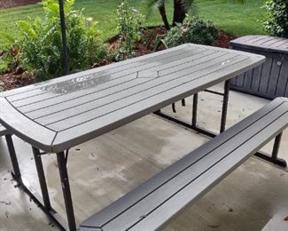 Outdoor table that folds flat