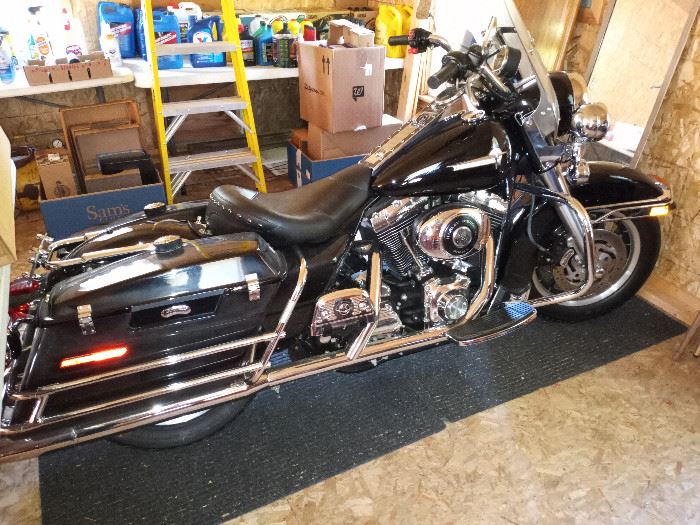 Harley Davidson FLHPI 2000 .  Motorcycle is in the garage.