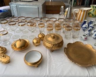 Vintage gold-tone glassware and serving pieces.