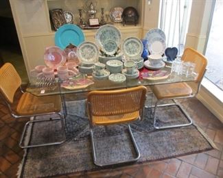 Nice vintage glass top table w/ 4 vintage chrome/cane chairs