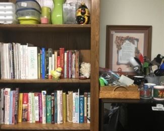 Kitchen - large shelf unit full of cookbooks, can ok’ing pamphlets & more