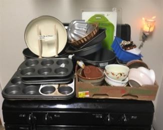 Cookware, muffin pans, cake pans, bowls & lots more in kitchen