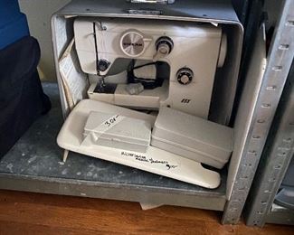Riccar Sewing Machine with accessories and carrying case