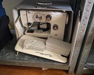 Riccar Sewing Machine with accessories and carrying case