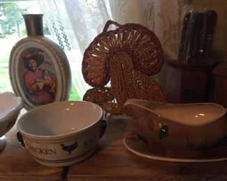A vintage mushroom trivet, bourbon bottle, soup dish and gravy boat.