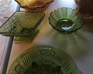 Colored glassware adds a pop of color and style. Here, two flower bowls, a footed bowl and a divided dish.