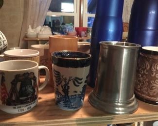 A seleCtion of mugs to commemorate special times in history and different geographical locations.