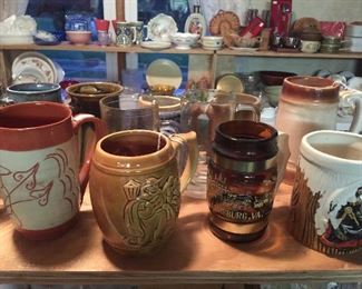 More souvenir and novelty mugs and steins.