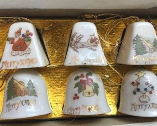 Half of 12 miniature porcelain bells in original box.