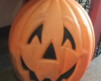 A jack-o-lantern blow mold grins as he thinks about celebrating Halloween in a new home.