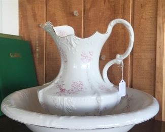 A bowl and pitcher set with dainty flowers is idea for a commode, dry sink or even a dresser.