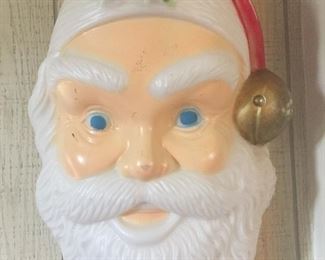 A blow mold of Santa’s face is nearly 2-feet long and ready to greet holiday visitors.