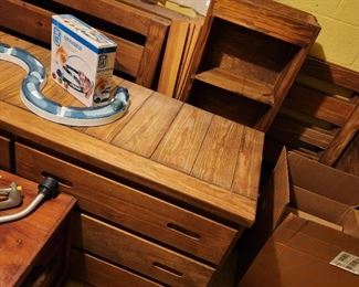 Kirby Furniture, similar to This End Up, solid wood and very heavy. (if considering this, bring loading/moving help)