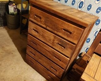 Kirby Furniture, similar to This End Up, solid wood and very heavy. (if considering this, bring loading/moving help)