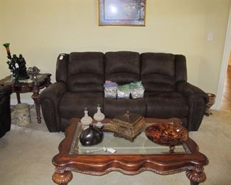 This sofa has recliners on both ends.