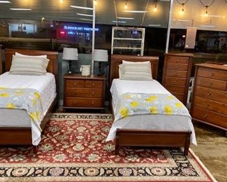 DURHAM FURNITURE CO. (Est. in 1899),  Hand Crafted in Canada, Solid Wooden TWIN Mahogany Sleigh Beds, with 4 Matching Pieces: Two LINGERIE CHESTS with Graduating Drawer Sizes, a Large Chest of Drawers, and a 36" Bedside Chest (between beds). Each piece sold separately OR buy it all at a reduced price. (Includes exquisite mattresses)