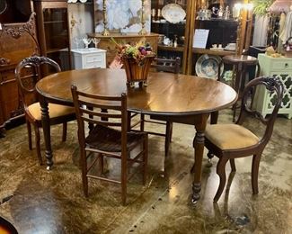 Antique Oak Table with 2 leaves, on casters, with 4 Antique Chairs 