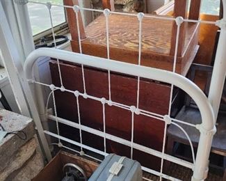 Vintage luggage and antique twin bed