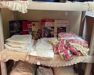 Hand stitched linens, lace, napkins, cook books, Pyrex, bookends.