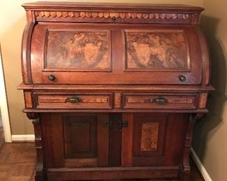 Walnut Burl Cylinder roll top desk with casters.