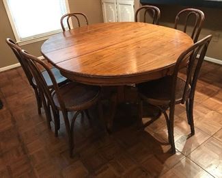 Love this Oak Round Table with 1 leaf.  6 Bentwood chairs.