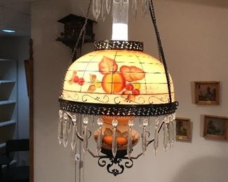 Love this painted pendant lamp with prisims.  Electrician needs to remove.