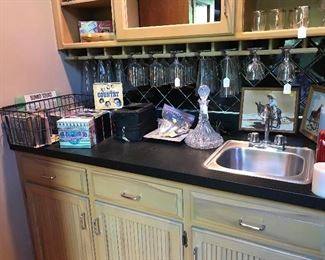 This bar features Games, CD's, Glasses, Decanter, Paint by Number pictures