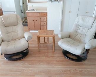 2 matching leather rocking swivel chairs
