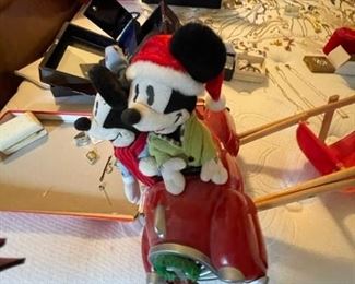 Mickey riding car.