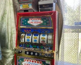 Small slot machine with tokens. 
