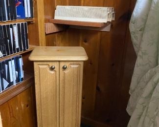 VHS tapes and small cabinet.