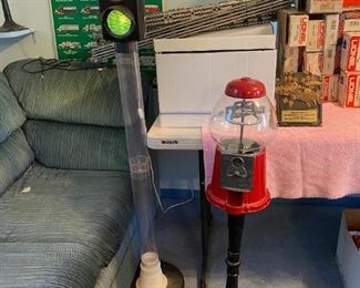 Gumball machine and red light bank.