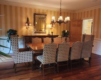 Table: 31"h x 96"w x 48"d, plus 2 leaves (24" each). side chairs (10) 40"h x 21"w x 20"d, armchairs (2): 46 x 26 x 24