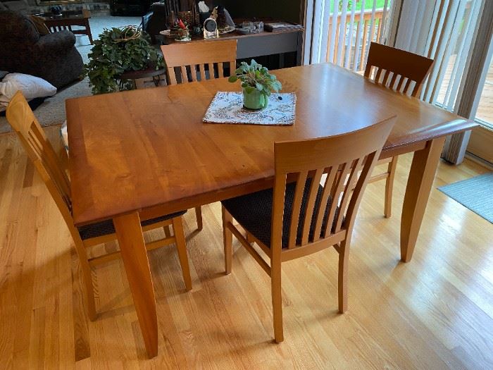 Arhaus Cherry Dining Table w/ 6 chairs and 2 leaves Measures: 60" X 42" w/o leaves, leaves measure 18" ea.