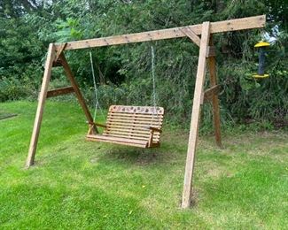 Self Standing outdoor love seat swing with carved grapevine decor                                                                                  Please note: This item may be purchased ahead the Sale