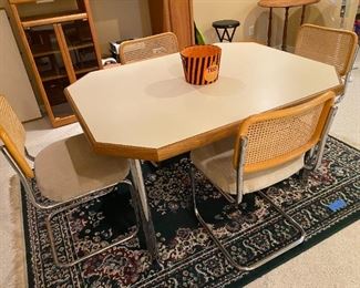 Mid Century Chrome & Cane  Dining Table Table w/ 2 leaves                                                                                          Measures: 41 1/2" x 53" w/o leaves, leaves measure 18" each