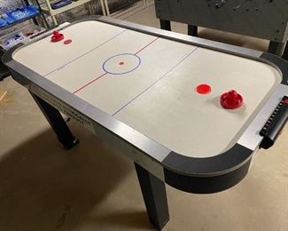 Air Hockey Table by Spalding                                       Measures: 74" x 35"                                                                           Please note: This item may be sold before the Sale