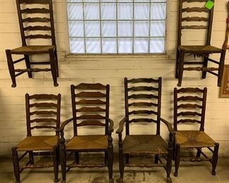 18th Century hand crafted dining chairs (six) of varying sizes (two captain’s chairs) with rush seats