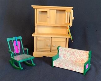 Various sized dollhouse furniture.