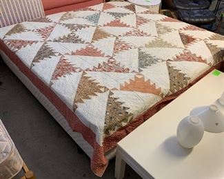 Hand stitched quilt. Pictured covering two twin mattresses (75” wide). Queen size, but would also fit full size. In “as-is” condition. Needs talented TLC!