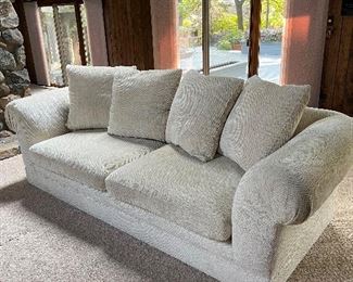 matching oversized roll arm off-white sofas; each measures 103"W x 45"D x 38"H - 2 cushion seats and 4 back pillows