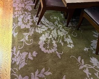 The Rug Company custom loden green background and lavender / purple floral design - Design style "Carmelina" measures 14 ft x 9'1" - 100% carded Tibetan Wool, Nepal