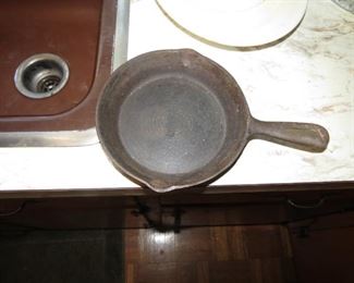 SMALL CAST IRON PAN.