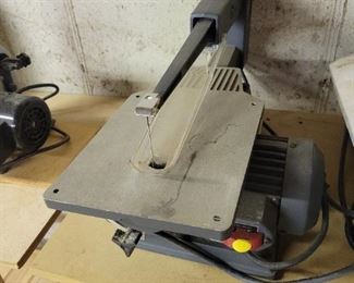 Craftsman 16 inch Direct Drive Saw with a box of many blades.